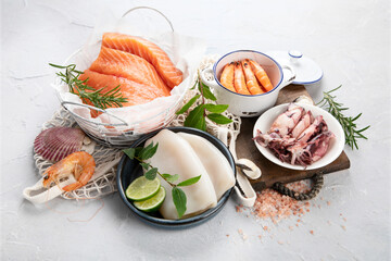 Fresh seafood arrangement on light background.