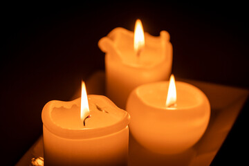 Fototapeta na wymiar three burning candles, Mallorca, Balearic Islands, Spain