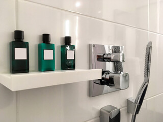 Modern design bathroom with sink, bathtub, towels and mirror and mosaic tiles in cabin or stateroom...