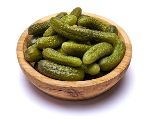 Bowl of Tasty canned Whole green cornichons isolated on a white background