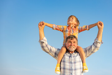 Grandfather and boy having fun outdoor