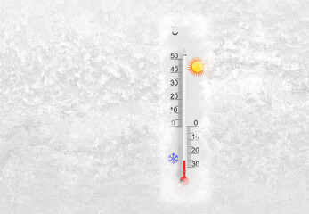 Outdoor thermometer on a frozen window shows minus 25 degrees celsius temperature in cold winter day
