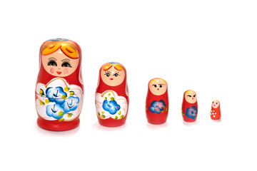 Red dolls on a white background. Russian national souvenir. Matryoshka.