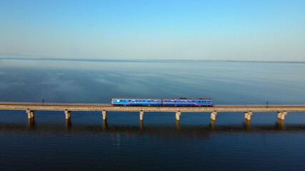 Motion blur of Train is running at high speed on a floating railway bridge. Aerial view of Train...