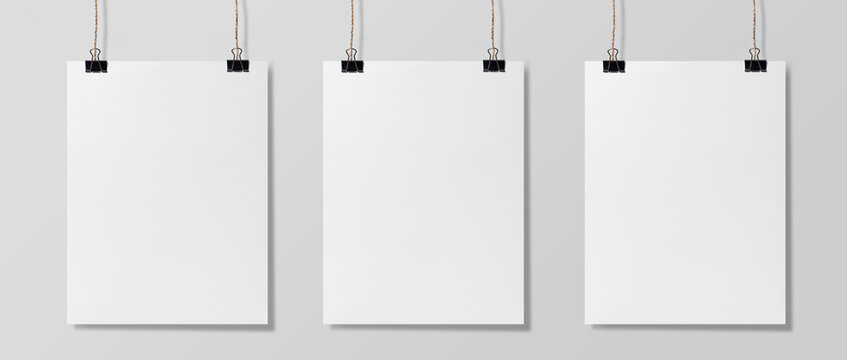 Three blank white poster hanging up, Mock-up poster and mockup template isolated on  white background.