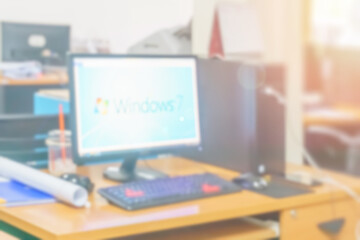 Naklejka premium Blur business office working computer on desk busy at building interior room background