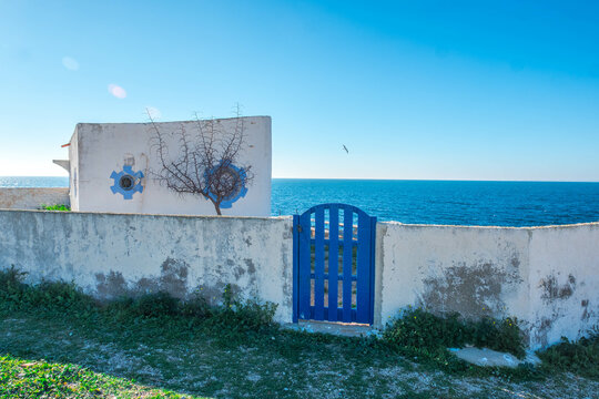 An abandoned house on the edge of the cliff on the old island of Tabarca, in the Spanish Mediterranean, in front of Santa Pola, Alicante