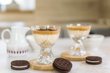 Coffee trend - Dalgona coffee, whipped instant coffee on stone background with copy space