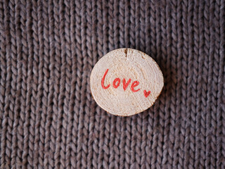 words of love and heart on wooden saw cuts
