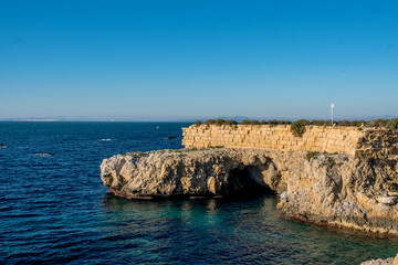 Fototapeta na wymiar The cave of the sea lion in a cliff of the old island of Tabarca, in the Spanish Mediterranean, in front of Santa Pola, Alicante