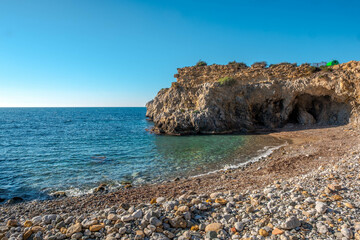 Obraz premium The cave of the sea lion in a cliff of the old island of Tabarca, in the Spanish Mediterranean, in front of Santa Pola, Alicante