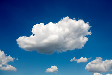 Fluffy white clouds in blue sky © Kashper