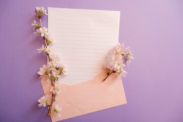 Spring greeting concept. Blank card decoration with Cherry blossoms on purple background. Spring,...