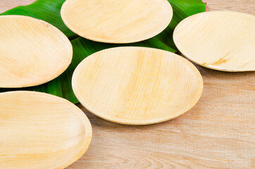 Kitchenware made from dried betel nut leaf palm, natural material.