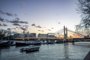 Albert Bridge, London Albert Bridge is a road bridge over the Tideway of the River Thames...