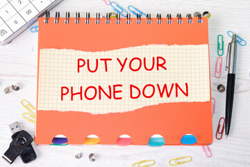 Put Your Phone Down a phrase on a piece of paper next to stationery