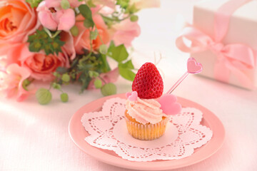 Valentine cupcake with white chocolate and strawberry cream with strawberry 
Valentine bouquet of rose flowers  and gift.