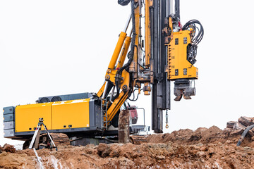 A powerful drilling rig for peeling at a construction site. Operation of the drilling rig in...