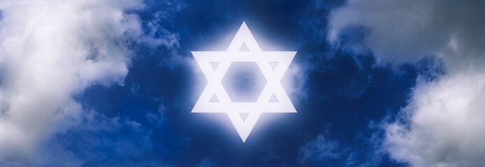 Star of David, symbol of Israel, shining on the sky amongst clouds.