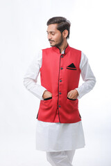 Young indian farmer in traditional wear and giving expression on white background.