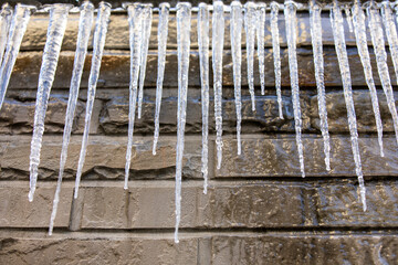 Icicles hanging on the home gas pipeline