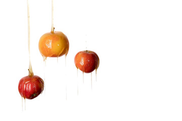 Honey flows over three apples. High quality