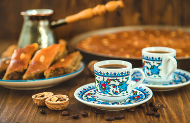 Baklava on the table and Turkish coffee. Selective focus.