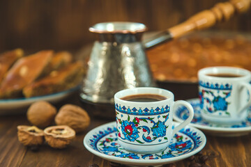 Baklava on the table and Turkish coffee. Selective focus.