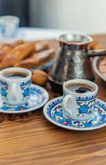 Baklava on the table and Turkish coffee. Selective focus.