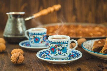 Baklava on the table and Turkish coffee. Selective focus.
