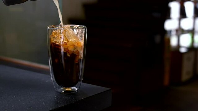 glass of coffee with milk on the table