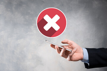 Hand holds icon,cancellation symbol,cancel icon.Cross mark flat red icon.round X mark.cancel...