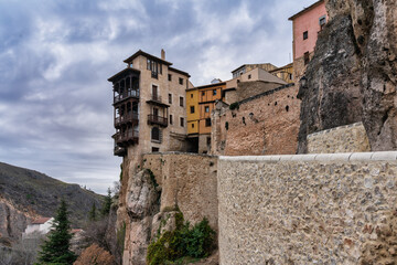 Fototapeta na wymiar hanging house no cliff with wooden balconies in Cuenca, Spain.
