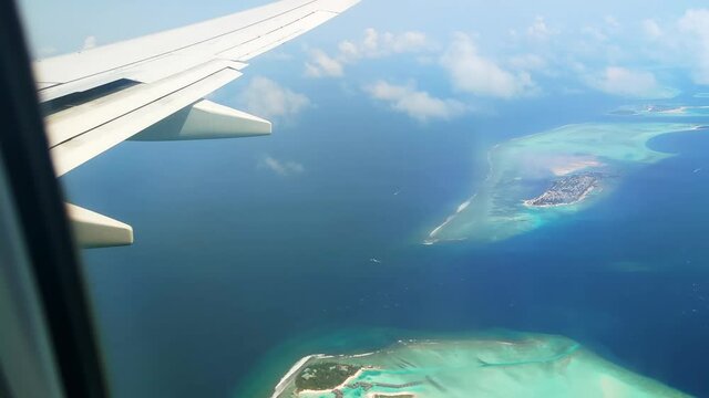 View from plane window on Maldivian islands.