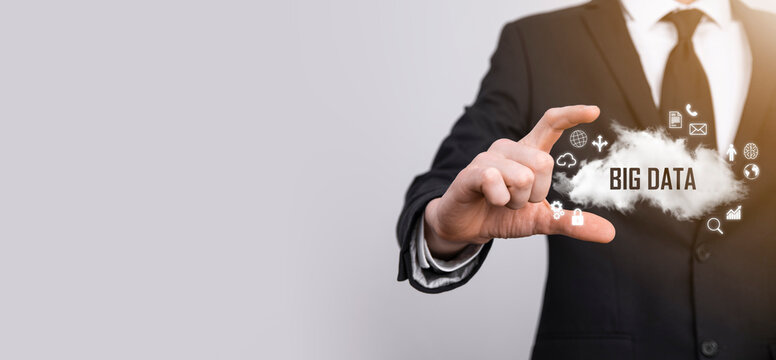 Businessman holds the inscription , word BIG DATA. Padlock , brain ,man, planet,graph, magnifier, gears, cloud, grid, document, letter, phone icon.