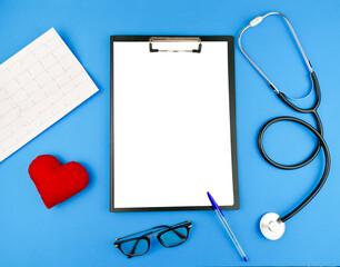 Doctor's table with stethoscope, cardiogram, thermometer, medical mask and red heart, top view