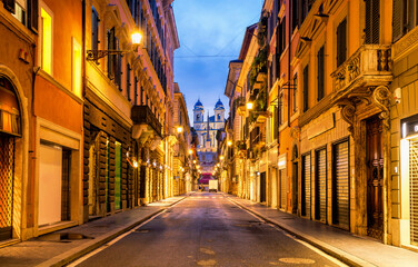 Fototapeta na wymiar Piazza de Spagna in Rome, italy. Spanish steps in the morning. The street looking towards the Spanish Steps. Via dei Condotti.