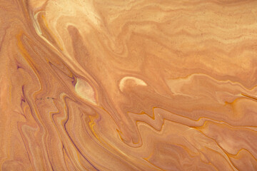 Abstract fluid art background brown and copper colors. Liquid marble. Acrylic painting with beige gradient.