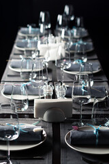 beautifully laid tables with glasses and appliances in restaurant