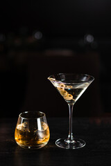 two cocktails for a man and a woman on the bar counter