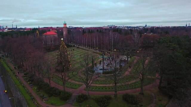 Aerial view of a memorial at the Hietaniemi graveyard&acute;s Heroes' Cemetery, in Helsinki, Finland - pull back, drone shot
