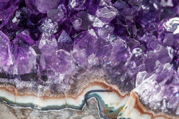 Obraz premium Amethyst Crystal Druse macro mineral on white background
