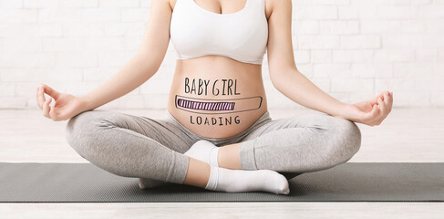 Closeup of active pregnant woman meditating in lotus position indoors, baby girl progress loading...