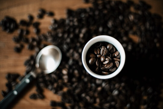 Coffee cup filled with coffee beans top view Stock Photo | Adobe Stock