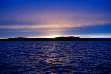 Fiery sunset over the water in the Tatar Strait