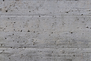 Contrasty texture of rough grey concrete wall