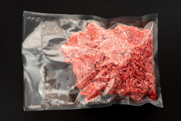 Minced beef in vacuum packed sealed for sous vide cooking on nero background