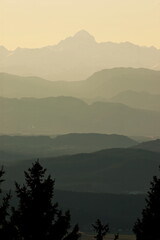 The highest peak of Julian Alps with hazy evening sky and mountain ranges