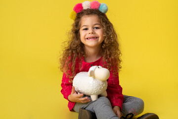 Cute girl kid holding money box in  bank for future saving