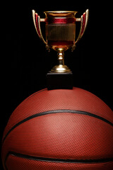 image of basketball gold cup dark background 